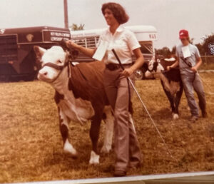 Carol Coley McDonald showing a Hereford heifer
