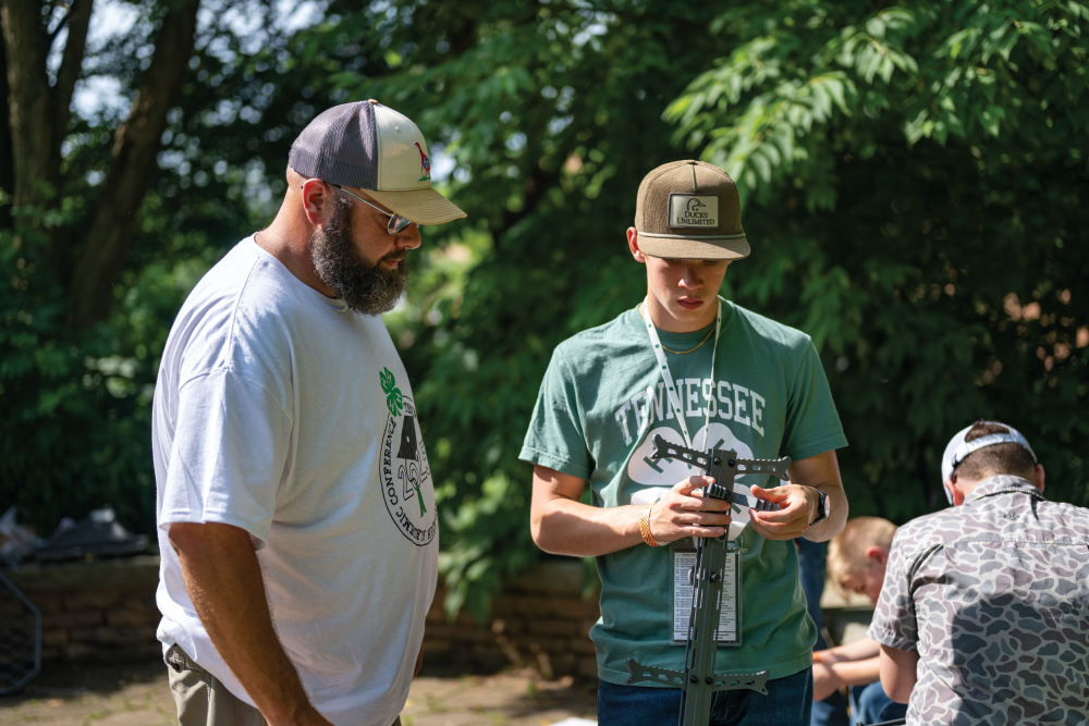 During Academic Conference, Outdoor Recreation and Shooting Sports project members learn how to use a tree stand from instructor Ronnie Cowan
