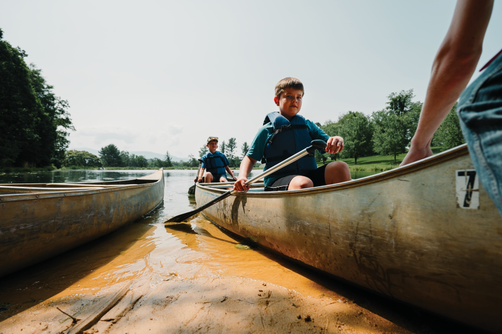 Campers take out canoes at the 4-H Camp in Greeneville